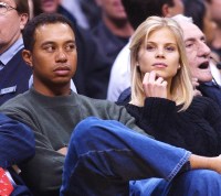 ©2003 RAMEY PHOTO 310-828-3445Tiger Woods and his girlfriend Elin Nordegren of Sweden sit courtside during the NBA game between the Los Angeles Lakers and the Houston Rockets February 18, 2003 at Staples Center in Los Angeles. Woods, who recently won the Buick Invitational in San Diego, will compete in the Nissan Open in Los Angeles this weekend.JR21803 (Mega Agency TagID: MEGAR109578_5[3].jpg) [Photo via Mega Agency]