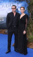 Actors Brad Pitt and Angelina Jolie pose for photographers as they arrive for the Maleficent exhibit in Kensington Gardens, in west London, . The exhibit showcases some of the costumes and props from the film Maleficent, before they go on display to the public at the O2 in London
Britain Maleficent Event, London, United Kingdom - 8 May 2014