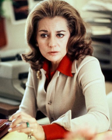 Book cover use of this asset requires approval. Please contact your Account Representative.Mandatory Credit: Photo by Nancy Moran/Condé Nast/Shutterstock (12813429a)Barbara Walters sits at her desk for NBC's Today show in Rockefeller Plaza, New York, New York. One forearm is resting on her desk, and she looks to the side of the camera. She wears a tan sweater jacket over a red collared blouse; a typewriter and other office supplies sit in the background.Vogue August 01, 1973 Portrait, New York, USA