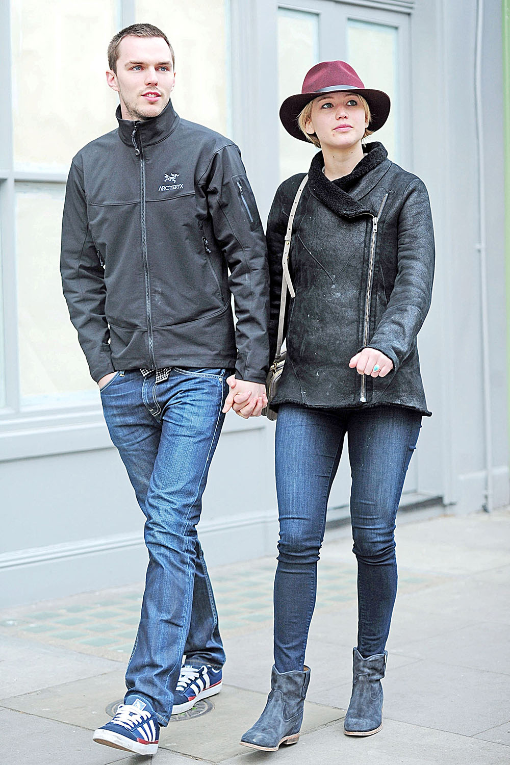 Jennifer Lawrence takes a break from her busy schedule and winds down with a fun and relaxing lunch with her boyfriend, Nicholas Hoult in London.  The pair sat outside smoking while Nicholas chatted on the phone with who appears to be a mutual friend as Jennifer would take the phone away from her beau to chat with the caller.  After their meal, the couple left the restaurant walking hand-in-hand and Jennifer flashed a pretty turquoise ring on her ring finger.  Could the pair be engaged? Shot on April 24, 2014