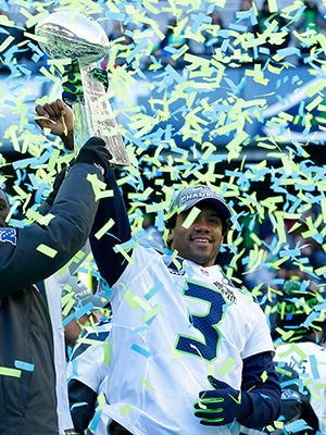 Paul Allen, Russell Wilson Seattle Seahawks owner Paul Allen, left, lifts the Vince Lombardi Trophy with Seahawks quarterback Russell Wilson (3) during a rally, in Seattle. The Seahawks defeated the Denver Broncos on Sunday in NFL football's Super Bowl XLVIII game in East Rutherford, N.JSeahawks Parade Football, Seattle, USA
