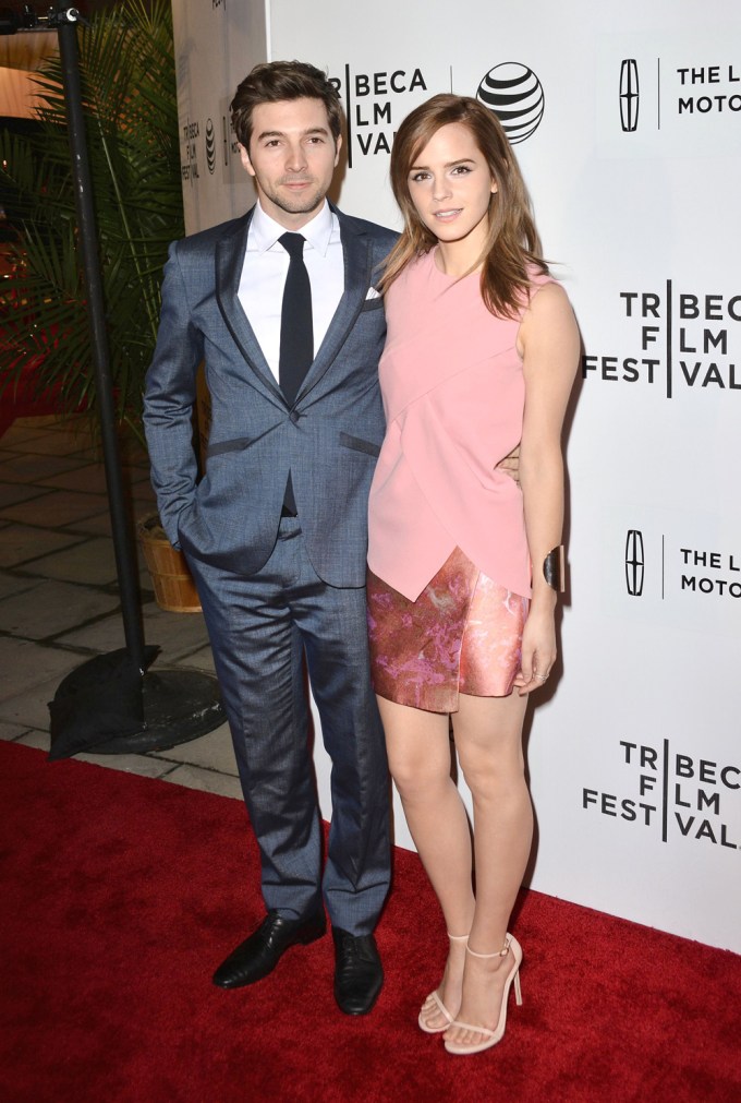 Emma Watson & Roberto Aguire on a red carpet