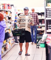 EXCLUSIVE: Jon Hamm Looked Cozingly Native In A Funky Sweater As He Grocery Shopped At Gelsons In Hollywood, CA. The Top Gun Star Was Seen Browsing The Aisles In Aviators and Flip Flops While Filling Up His Basket. 06 Jun 2022 Pictured: Jon Hamm. Photo credit: @CelebCandidly / MEGA TheMegaAgency.com +1 888 505 6342 (Mega Agency TagID: MEGA865788_003.jpg) [Photo via Mega Agency]