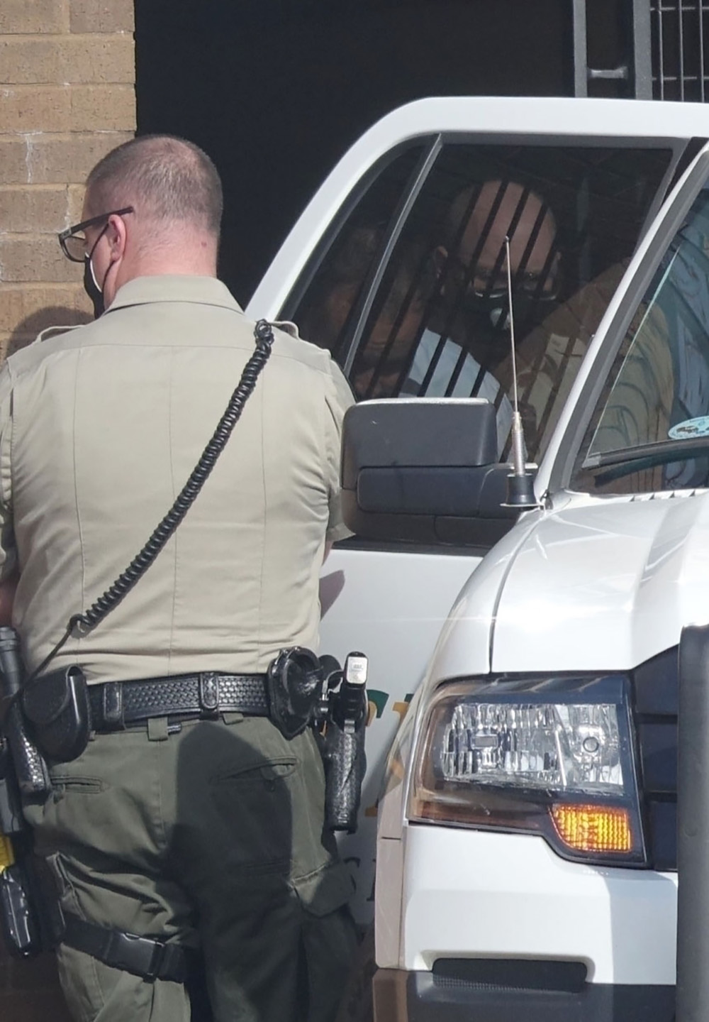 *EXCLUSIVE* Josh Duggar, head bowed, is taken away from court after being convicted of child porn offenses