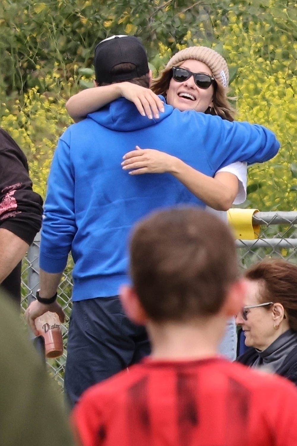 Jason Sudeikis and Olivia Wilde share a hug at their son's soccer match in LA!