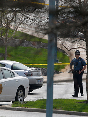 A Kansas State Trooper stands near the location of a shooting at the Jewish Community Center in Overland Park, KanFatal Shooting Kansas, Overland Park, USA - 13 Apr 2014