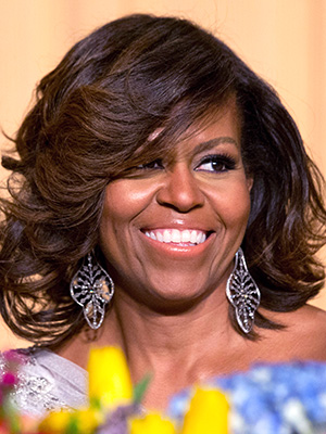 Michelle Obama First lady Michelle Obama laughs while listening to President Obama's speech during the White House Correspondents' Association (WHCA) Dinner at the Washington Hilton Hotel, in WashingtonObama Correspondents, Washington, USA