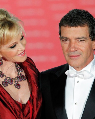 Spanish actor Antonio Banderas, right,  and US actress Melanie Griffith, left, pose on arrival for the "Goya" Film awards ceremony  in Madrid, Spain, Sunday, Feb. 19, 2012. (AP Photo/Andres Kudacki)