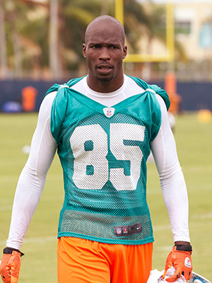 Miami Dolphins' Chad Ochocinco, who recently changed his name back to Chad Johnson, talking to reporters in Davie, Fla. The Dolphins terminated the six-time Pro Bowl receiver's contract about 24 hours after he was arrested in a domestic battery case involving his wife. Johnson was released from jail on $2,500 bond, after his wife accused him of head-butting her during an argument in front of their homeDolphins Johnson Arrest Football, Davie, USA