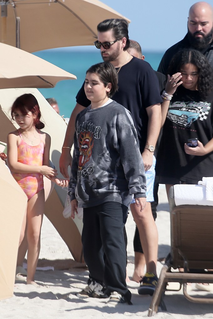 Mason Disick on the beach with his dad and siblings