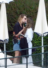 Cara Delevingne, wearing a t-shirt with Bob Marley's picture, seen kissing a new girlfriend singer Minke in the park of Hotel Splendido in Portofino. 07 Jun 2022 Pictured: Cara Delevingne. Photo credit: Oliver Palombi / MEGA TheMegaAgency.com +1 888 505 6342 (Mega Agency TagID: MEGA866175_001.jpg) [Photo via Mega Agency]