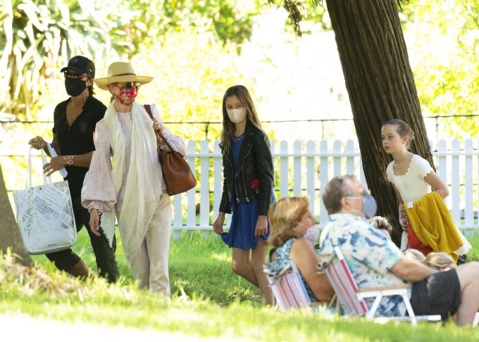 Nicole Kidman walking outside with keith Urban and their daughters