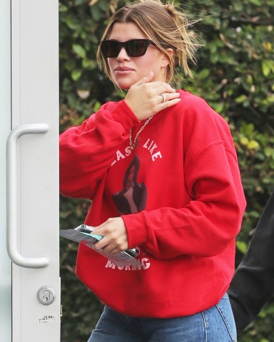 Beverly Hills, CA  - *EXCLUSIVE*  - Sofia Richie is spotted going  to Alo yoga store in Beverly Hills on Monday wearing a Xmas Lionel Richie sweater and a very nice diamond ring on her right ring finger. The young model wore  a red crew that honored her dad Lionel with a holiday take on his famous song, "Easy.''

Pictured: Sofia Richie

BACKGRID USA 7 DECEMBER 2021 

USA: +1 310 798 9111 / usasales@backgrid.com

UK: +44 208 344 2007 / uksales@backgrid.com

*UK Clients - Pictures Containing Children
Please Pixelate Face Prior To Publication*