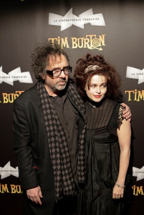 Tim Burton, Helena Bonham-Carter Filmmaker Tim Burton, left, and his wife Helena Bonham-Carter, pose as they arrive for the opening of his exhibition, a retrospective of his work, in ParisFrance Tim Burton, Paris, France