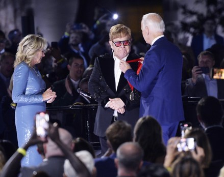 United States President Joe Biden presents Sir Elton John with the National Humanities Medal after he preformed a show called "A Night When Hope and History Rhyme" as part of his farewell tour on the South Lawn of the White House in Washington, DC on Friday, September 23, 2022.
Elton John Preforms on the South Lawn of the White House, Washington, District of Columbia, USA - 23 Sep 2022