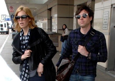 Mandy Moore and new husband Ryan Adams embrace married life together and joke around as they got of their flight in Los Angeles.  Laughing and smiling at each other, the couple walked to an awaiting limousine at LAX.  The rocker couple both wore tight jeans, shoulder bags, and sunglasses.

Pictured: Mandy Moore and Ryan Adams,Mandy Moore
Ryan Adams
Ref: SPL88521 210309 NON-EXCLUSIVE
Picture by: SplashNews.com

Splash News and Pictures
Los Angeles: 310-821-2666
New York: 212-619-2666
London: 0207 644 7656
Milan: 02 4399 8577
photodesk@splashnews.com

World Rights