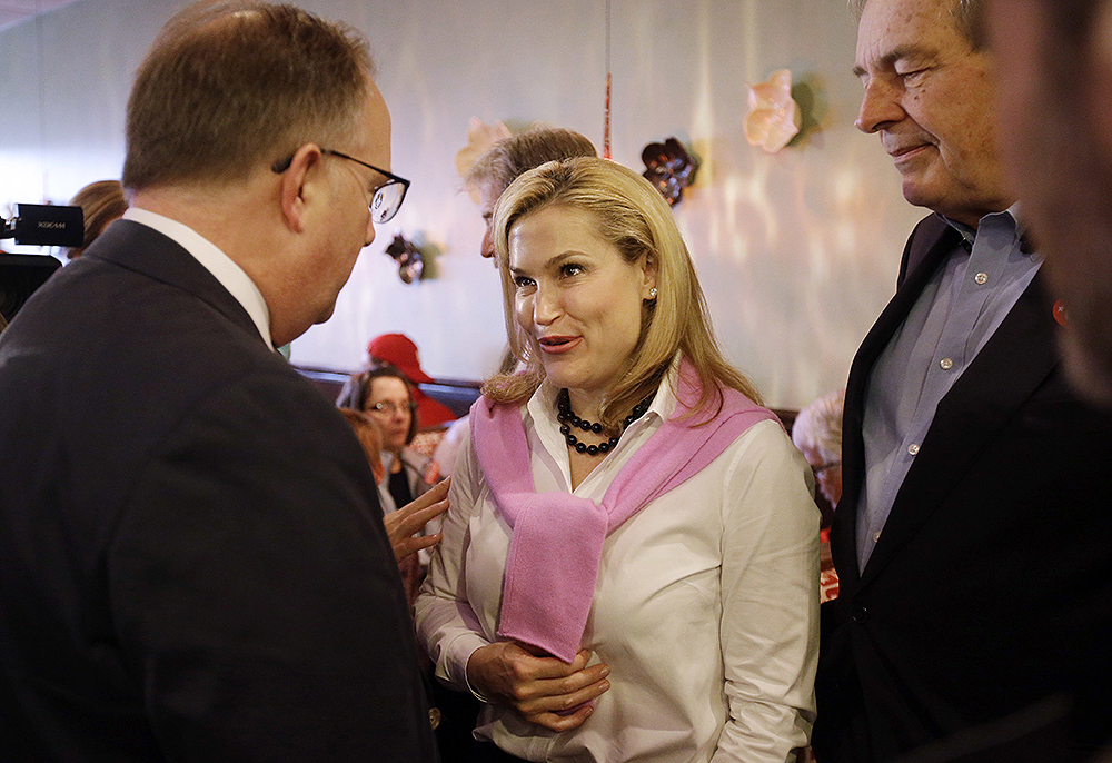 Heidi Cruz, wife of Republican presidential candidate, Sen. Ted Cruz, R-Texas, talks with supporters during a campaign stop at Lincoln Square Pancake House, Tuesday, May 3, 2016, in Westfield, Ind. (AP Photo/Darron Cummings)