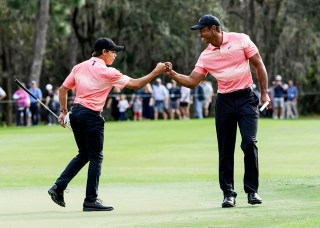 Tiger Woods, right and his son Charlie Woods, right, bump fists during the first round of the PNC Championship golf tournament, in Orlando, Fla
PNC Championship Golf, Orlando, United States - 17 Dec 2022