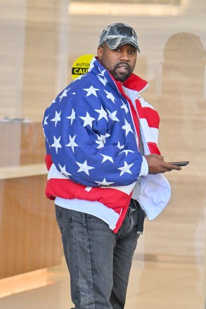 Kanye West heads to a meeting in Sherman Oaks after church. Kanye was seen wearing an oversized American flag bomber jacket. 27 Nov 2022 Pictured: Kanye West. Photo credit: @CelebCandidly/ Snorlax / MEGA TheMegaAgency.com +1 888 505 6342 (Mega Agency TagID: MEGA921309_001.jpg) [Photo via Mega Agency]