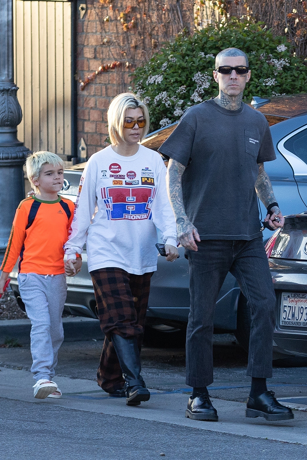 Calabasas, CA  - *EXCLUSIVE*  - Reality star Kourtney Kardashian sports a laidback look while out for an early dinner with her son Reign and husband Travis Barker at his restaurant Crossroads Kitchen. The vegan restaurant located in Calabasas has been a hit among the city's foodies, and its plant-based cuisine is well-known in the vegan community. The couple was seen holding hands as they arrived at the restaurant, and their casual outfits perfectly complemented each other.Pictured: Kourtney Kardashian, Travis BarkerBACKGRID USA 2 APRIL 2023 BYLINE MUST READ: LAGOSSIPTV / BACKGRIDUSA: +1 310 798 9111 / usasales@backgrid.comUK: +44 208 344 2007 / uksales@backgrid.com*UK Clients - Pictures Containing ChildrenPlease Pixelate Face Prior To Publication*