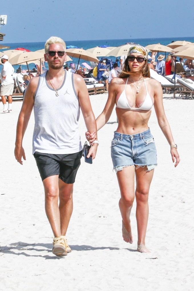 Scott Disick & Amelia Hamlin on a beach