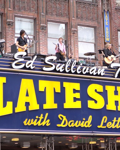 Paul McCartney
'The Late Show with David Letterman', New York, America - 15 Jul 2009
It was almost like January 1969 all over again, as Paul McCartney took to the top of the marquee of the Ed Sullivan Theatre for his performance last night on ‘The Late Show with David Letterman’ – a performance reminiscent of the Beatles’ iconic rooftop performance 40 years on top of the Apple Studios on London’s Savile Row.

It also harked back to another moment 45 years ago when the Beatles made their first American appearance at that same Ed Sullivan Theater.

Aptly, McCartney played the same song that his old band performed three times on top of the Apple Studios, ‘Get Back’, fittingly followed by one of his new songs, ‘Sing The Changes’, from his latest album, ‘Electric Arguments’, much to the delight of the assembled fans on the street down below, before chatting to host Letterman about that first US appearance and his relationship with the late Michael Jackson.