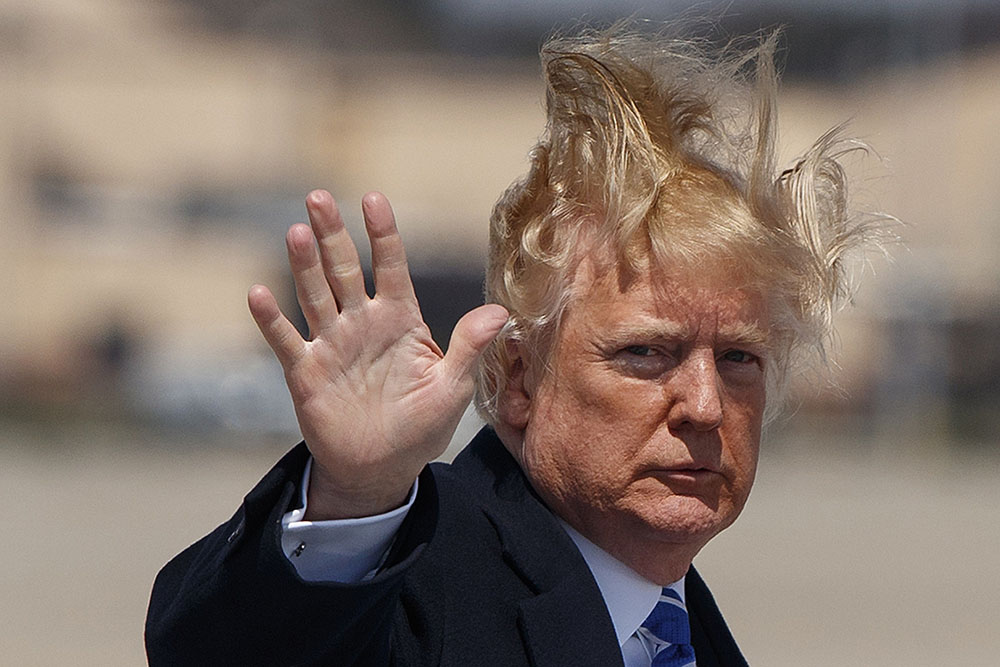 President Donald Trump waves as he boards Air Force One for a trip to White Sulphur Springs, W.Va., for an event on tax policy, Thursday, April 5, 2018, at Andrews Air Force Base, Md. (AP Photo/Evan Vucci)