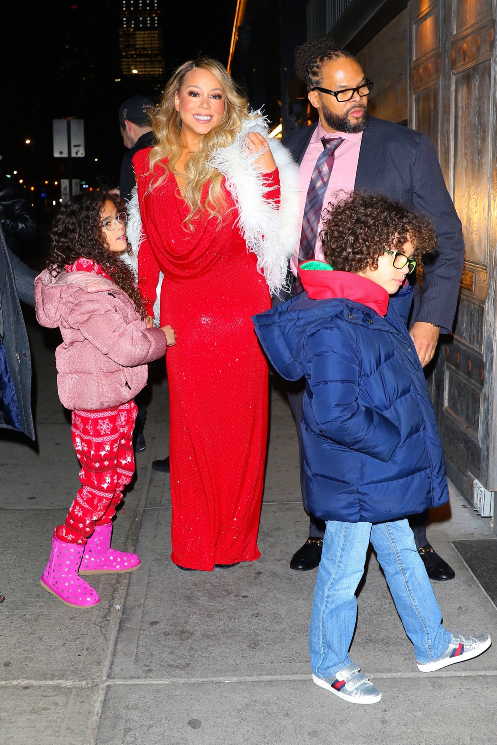 Mariah Carey celebrates her Christmas song potentially going #1 with her boyfriend and kids