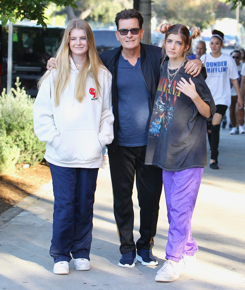 Charlie Sheen searched by security at the Billie Eilish concert and removes a clear container containing colored tablets