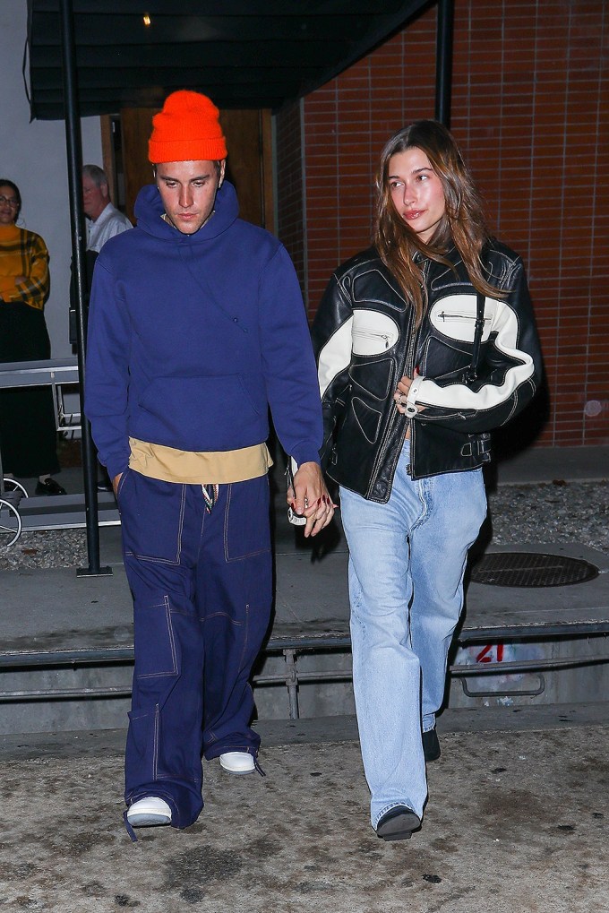 Justin & Hailey Hold Hands During A Rainy Dinner Date