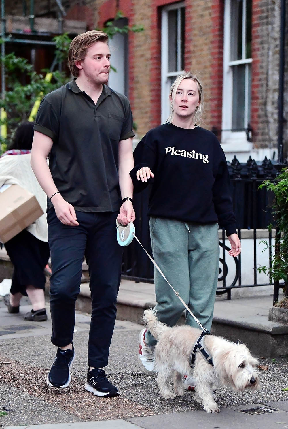 *EXCLUSIVE* The American-born Irish actress Saoirse Ronan and beau Jack Lowden donned a casual look whilst out with their new puppy as the pair looked loved up during their jaunt out in London