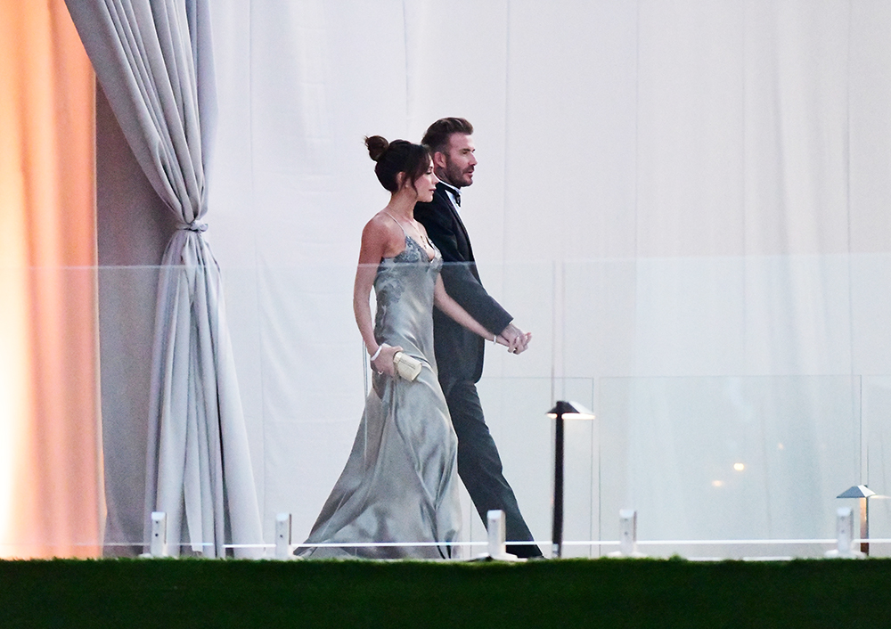 David Beckham and his wife Victoria Beckham enter the dinner tent after their son Brooklyn married Nicola Peltz in Palm Beach