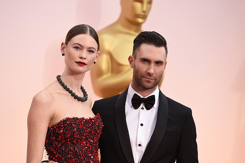 Adam Levine, right, and Behati Prinsloo arrive at the Oscars, at the Dolby Theatre in Los Angeles
87th Academy Awards - Arrivals, Los Angeles, USA - 22 Feb 2015