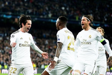 Real Madrid's Isco, left, celebrates with teammates after scoring his side's opening goal during the Champions League, round of 16, first leg soccer match between Real Madrid and Manchester City at the Santiago Bernabeu stadium in Madrid, Spain
Soccer Champions League, Madrid, Spain - 26 Feb 2020