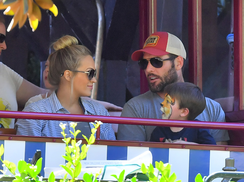 EXCLUSIVE: Pregnant Carrie Underwood and her husband, Mike Fisher take their son Isaiah, 3, on his first trip to Disneyland. The happy family, joined by one VIP tour guide as well as their own bodyguard, are seen enjoying many of the park's rides and attractions. Carrie stepped back and didn't ride too many of the rides possibly due to her pregnancy, but her son and husband enjoyed a rides in Cars Land, and the Pixar pier. They all enjoyed a ride on the train in Disneyland and a boat ride on It's a Small World. Carrie and her family also enjoyed snacks including some ice cream in Toon Town. The singer was not really noticed by fans on her Disney trip, however she did take a couple of selfies with a few fans that spotted her. The 35 year-old country music sensation revealed over the weekend that she endured three miscarriages in the last two years. 16 Sep 2018 Pictured: Carrie Underwood, Isaiah Fisher, Mike Fisher. Photo credit: Marksman/Snorlax / MEGA TheMegaAgency.com +1 888 505 6342 (Mega Agency TagID: MEGA276575_007.jpg) [Photo via Mega Agency]