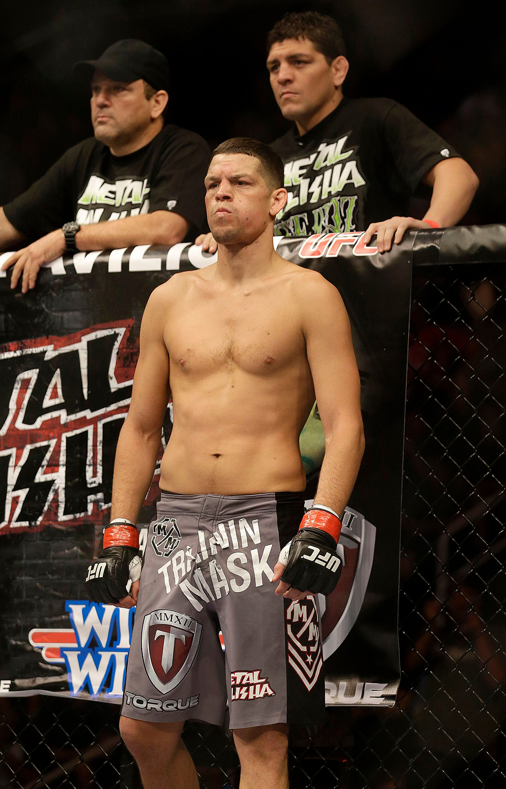 Nate Diaz, Nick Diaz, Cesar Gracie Nate Diaz, center, stands with trainer Cesar Gracie, top left, and Nick Diaz before a UFC lightweight mixed martial arts fight against Josh Thomson in San Jose, Calif., . Thomson won by technical knock out in the second round
UFC on Fox Mixed Martial Arts, San Jose, USA