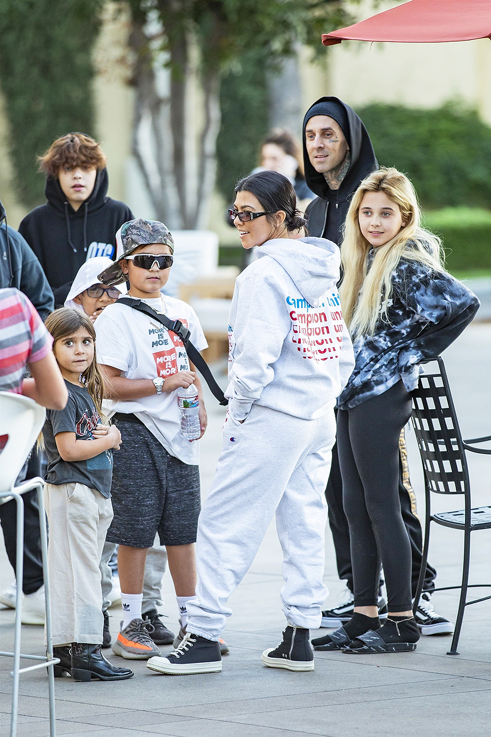 Calabasas, CA  - *EXCLUSIVE*  - Kourtney Kardashian takes the kids on a sweet treat date with Travis Barker. The duo look casual as the two families are seen leaving the ice cream parlor together.

Pictured: Kourtney Kardashian, Travis Barker

BACKGRID USA 2 DECEMBER 2018 

BYLINE MUST READ: IXOLA / BACKGRID

USA: +1 310 798 9111 / usasales@backgrid.com

UK: +44 208 344 2007 / uksales@backgrid.com

*UK Clients - Pictures Containing Children
Please Pixelate Face Prior To Publication*