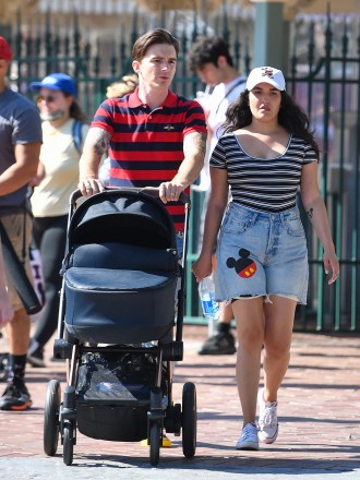 Drake Bell is seen for the first time since pleading guilty to child endangerment with a women who is believed to be his wife and a baby at Disneyland. The actor was seen celebrating his 35th birthday with his little family, putting his legal woes behind him as they enjoyed the happiest place on earth. **SPECIAL INSTRUCTIONS*** Please pixelate children's faces before publication.***. 27 Jun 2021 Pictured: Drake Bell. Photo credit: CelebCandidly / MEGA TheMegaAgency.com +1 888 505 6342 (Mega Agency TagID: MEGA765761_014.jpg) [Photo via Mega Agency]