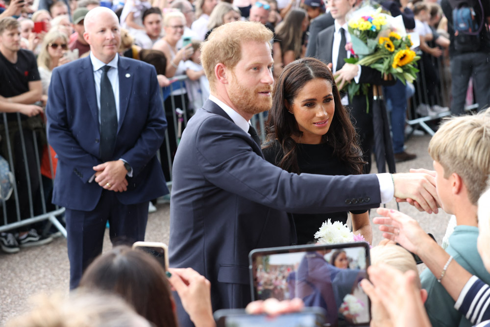 Prince and Princess of Wales along with Prince Harry and Meghan Markle the Duke and Duchess of Sussex looking at Floral Tributes and meeting well wishers at Windsor Castle