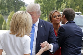 MAXPPP OUT
Mandatory Credit: Photo by MICHEL EULER/POOL/EPA/REX/Shutterstock (8960077h)
Emmanuel Macron, Melania Trump, Brigitte Macron and Donald J. Trump
Donald J. Trump's visit to Paris, France - 13 Jul 2017
French President Emmanuel Macron (R) welcomes First Lady Melania Trump (2-R) while his wife Brigitte (L) welcomes US President Donald J. Trump at Les Invalides museum in Paris, France, 13 July 2017. President Trump and French President Macron planned to meet 13 July in Paris to focus on issues where they can take US-French relations forward, with major security and defense topics among them.