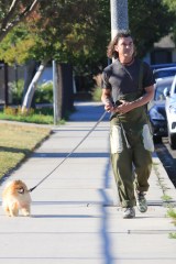 EXCLUSIVE: Gavin Rossdale in over-alls as he walks with Chewy at the park. The Bush rocker starts his holiday weekend right as he strolls in the park as his buddy walks next to him. 02 Jul 2021 Pictured: Gavin Rossdale. Photo credit: MEGA TheMegaAgency.com +1 888 505 6342 (Mega Agency TagID: MEGA767208_020.jpg) [Photo via Mega Agency]