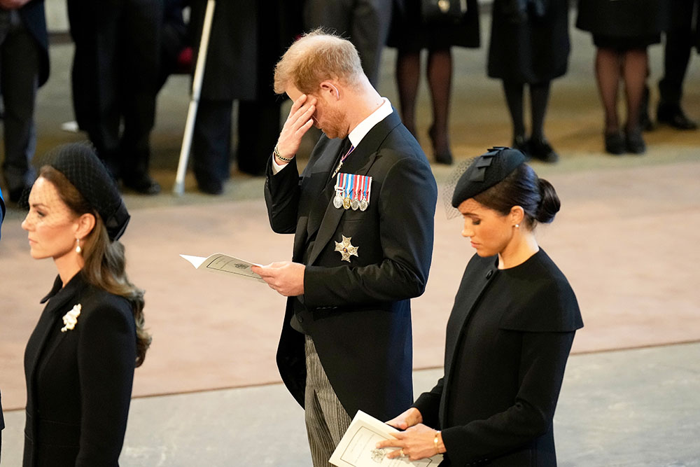 Catherine, Princess of Wales, Prince Harry, Duke of Sussex and Meghan, Duchess of Sussex pay their respects in The Palace of Westminster after the procession for the Lying-in State of Queen Elizabeth II on September 14, 2022 in London, England. Queen Elizabeth II's coffin is taken in procession on a Gun Carriage of The King's Troop Royal Horse Artillery from Buckingham Palace to Westminster Hall where she will lay in state until the early morning of her funeral. Queen Elizabeth II died at Balmoral Castle in Scotland on September 8, 2022, and is succeeded by her eldest son, King Charles III.  
Queen Elizabeth II's coffin procession from Buckingham Palace to Westminster Hall, London, UK - 14 Sep 2022