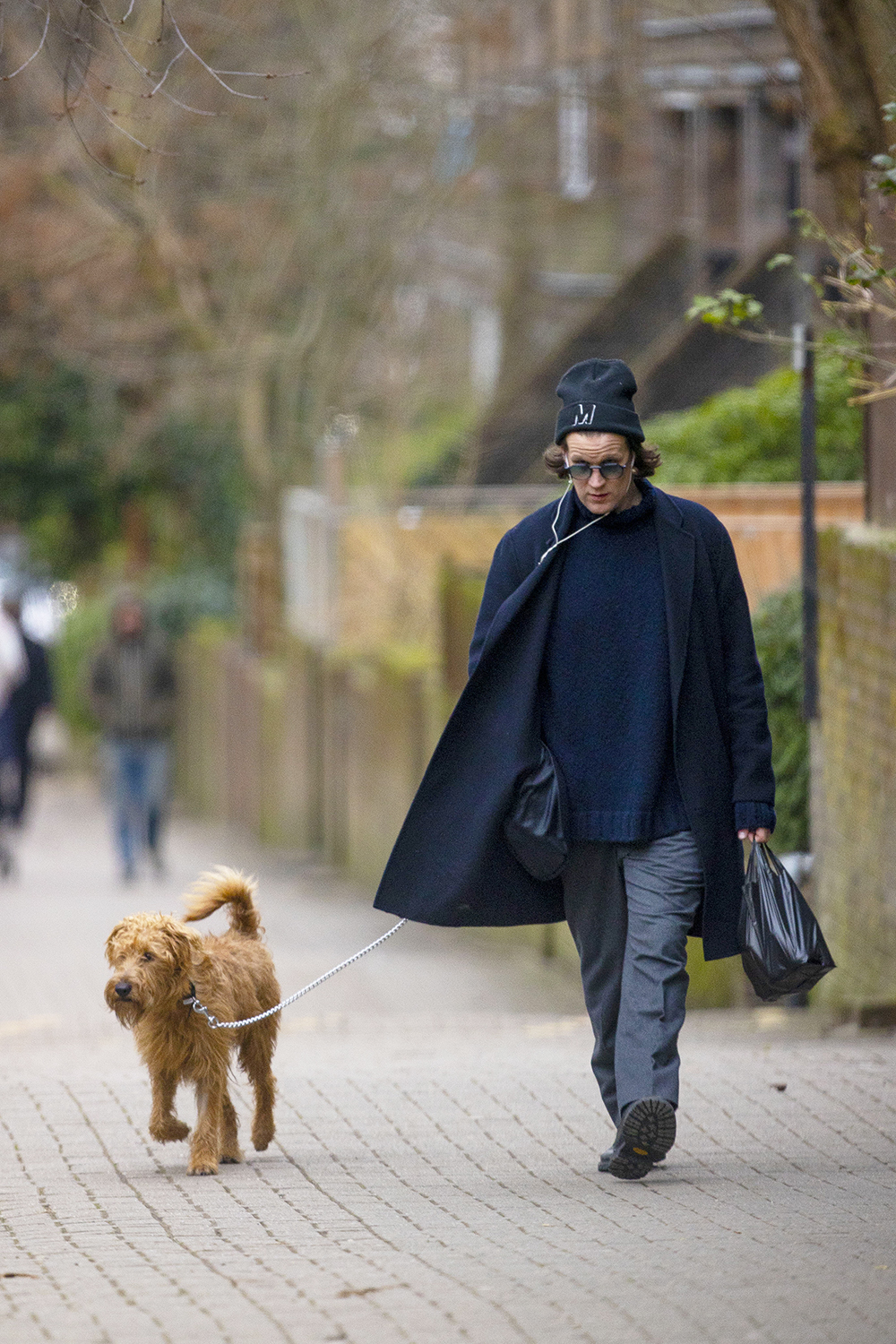 EXCLUSIVE: Matt Smith looks stylish as he walks his Irish Terrier Dog called Bobby in North London. 31 Jan 2022 Pictured: Matt Smith. Photo credit: MEGA TheMegaAgency.com +1 888 505 6342 (Mega Agency TagID: MEGA824178_002.jpg) [Photo via Mega Agency]