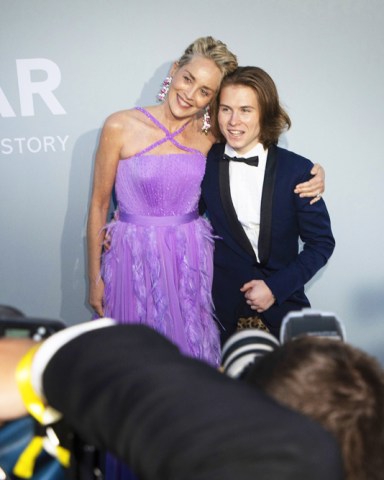 Sharon Stone, left, and Roan Joseph Bronstein pose for photographers upon arrival at the amfAR Cinema Against AIDS benefit the during the 74th Cannes international film festival, Cap d'Antibes, southern France
2021 amfAR Arrivals, Cannes, France - 16 Jul 2021