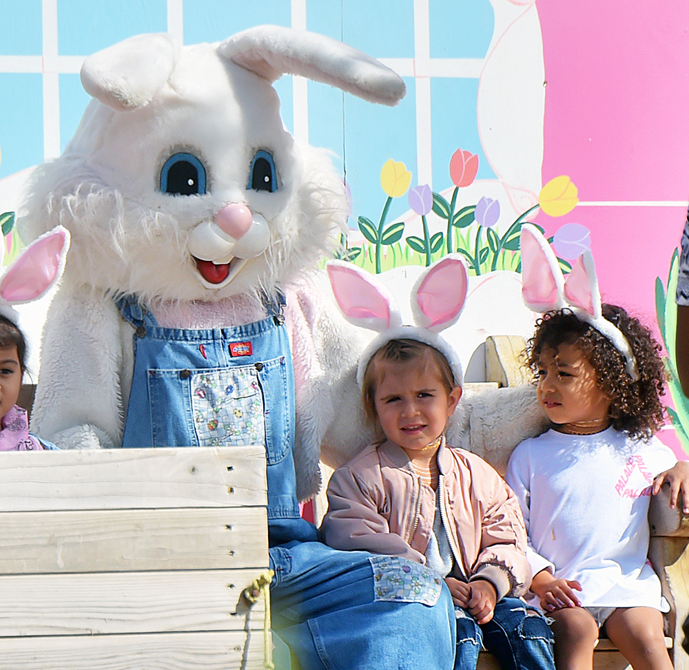 North West and Penelope Disick wear bunny ears as they take a picture with the Easter Bunny at Underwood Family Farms