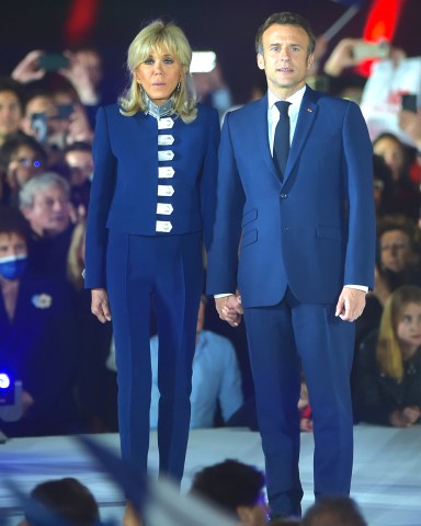 France's centrist incumbent president Emmanuel Macron stands with his wife Brigitte Macron after he beats his far-right rival Marine Le Pen for a second five-year term as president on April 24, 2022 in Paris
Emmanuel Macron re-elected as French President, Paris, France - 24 Apr 2022