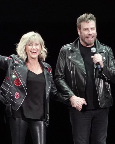 John Travolta and Olivia Newton John recreate their iconic Grease characters for the first time since the 1978 hit musical was made. The pair wowed fans in full costume at a ‘Meet ‘N Grease’ sing-a-long event in West Palm Beach, Florida. The film starred Travolta, now 65, as greaser Danny Zuko and Newton-John, now. 71, as Sandy. It became the highest-grossing musical film ever at the time. Its soundtrack album ended 1978 as the second-best selling album of the year in the United States, behind the soundtrack of the 1977 blockbuster Saturday Night Fever, which also starred Travolta. 13 Dec 2019 Pictured: John Travolta; Olivia Newton John. Photo credit: MEGA TheMegaAgency.com +1 888 505 6342 (Mega Agency TagID: MEGA568299_001.jpg) [Photo via Mega Agency]