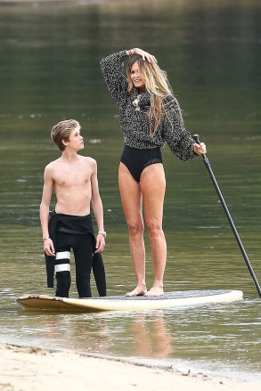 ** RIGHTS: ONLY UNITED STATES, CANADA ** Sydney, AUSTRALIA  - *EXCLUSIVE*  - Elle Macpherson with both of her sons Cy Busson and Flynn Busson are seen during a brand collections advertisement photoshoot. Elle who will turn 55 on March 29 looked amazing as she put her slender legs on display while posing on a paddleboard. The model was in great spirits during the shoot and could be seen having some belly laughs with her son Flynn.

Pictured: Photographer

BACKGRID USA 19 MARCH 2019 

BYLINE MUST READ: MTRX / BACKGRID

USA: +1 310 798 9111 / usasales@backgrid.com

UK: +44 208 344 2007 / uksales@backgrid.com

*UK Clients - Pictures Containing Children
Please Pixelate Face Prior To Publication*