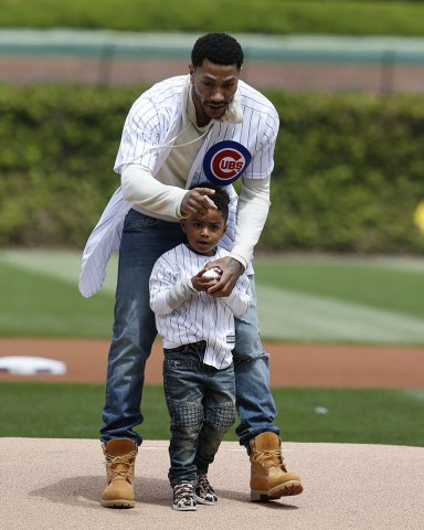 PJ Rose, Derrick Rose PJ Rose gets some final pointers from his dad Derrick Rose before throwing at the first pitch at Wrigley Field before a baseball game between the Pittsburgh Pirates and the Chicago Cubs, in ChicagoPirates Cubs Baseball, Chicago, USA