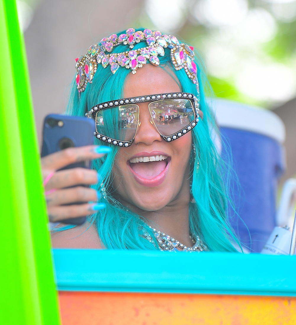 Rihanna was spotted partying hard at Cropover Festival Kadooment Day in Barbados . She looked amazing with a Blue Wig, and a Bejeweled Costume . She wore colorful feather headers as she waved to fans along the parade route. She seemed to be having an amazing time. Lewis Hamilton on the other hand, tried to get on the same float as his rumored ex, and she wanted no part. Him and his crew were forced to walk behind in the middle of the street.Pictured: Rihanna,Lewis Hamilton,RihannaLewis HamiltonRef: SPL1552165 070817 NON-EXCLUSIVEPicture by: SplashNews.comSplash News and PicturesLos Angeles: 310-821-2666New York: 212-619-2666London: +44 (0)20 7644 7656Berlin: +49 175 3764 166photodesk@splashnews.comWorld Rights